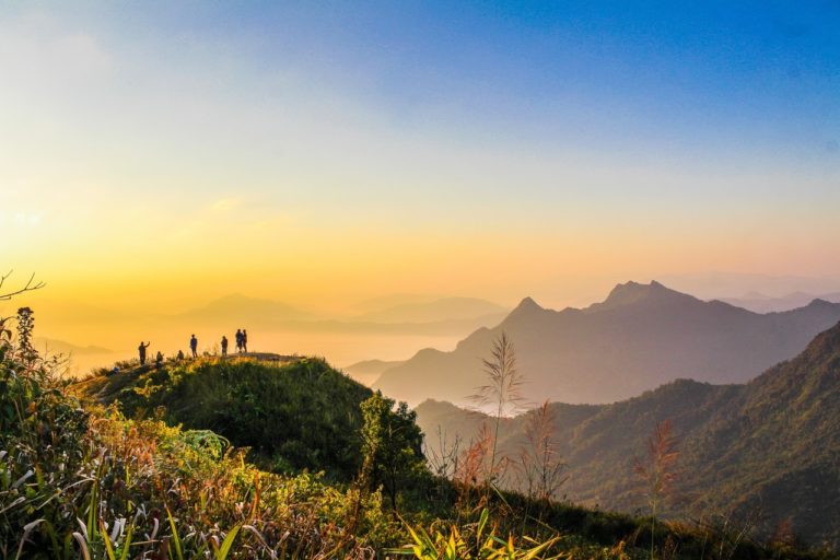 People standing on a hillside enjoying the freedom provided by smart working